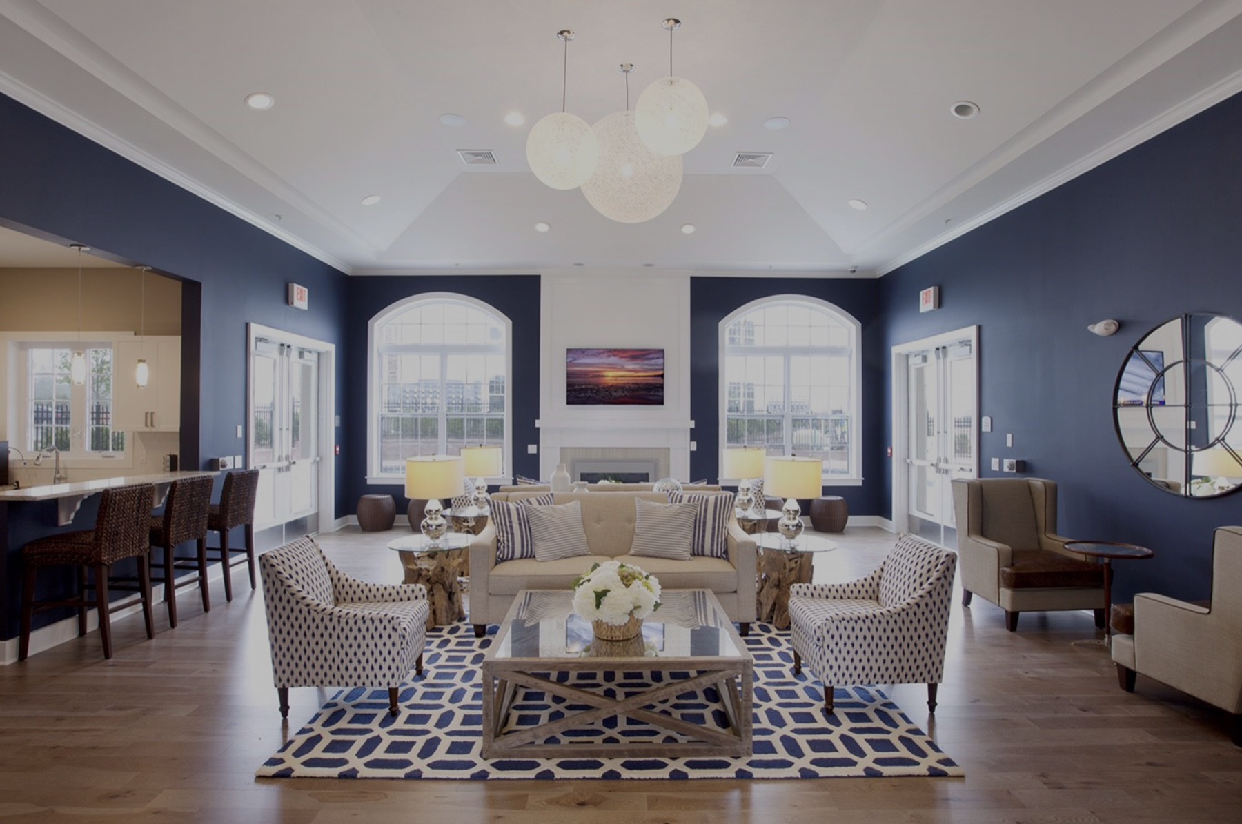 Living room with pendant lights and navy walls